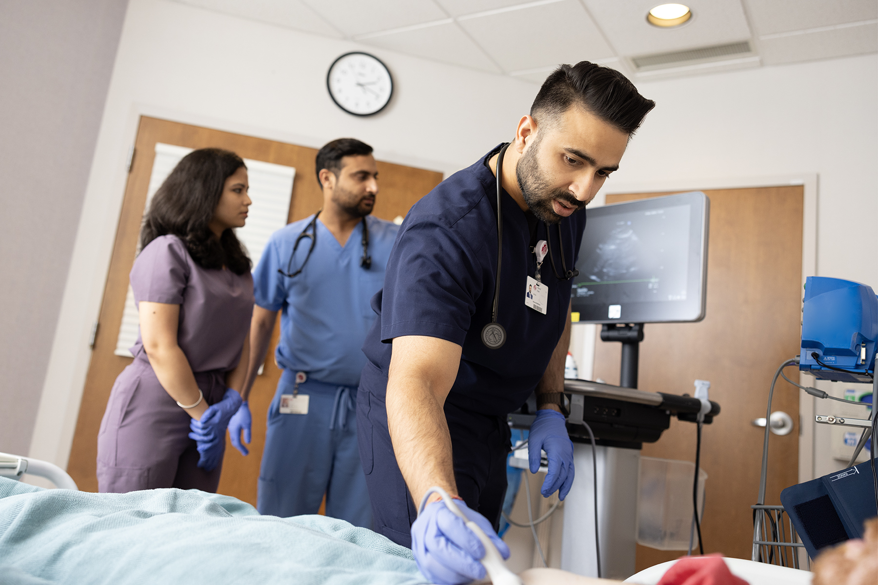 Resident and patient discuss case