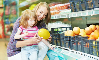 woman and child in a grocery store