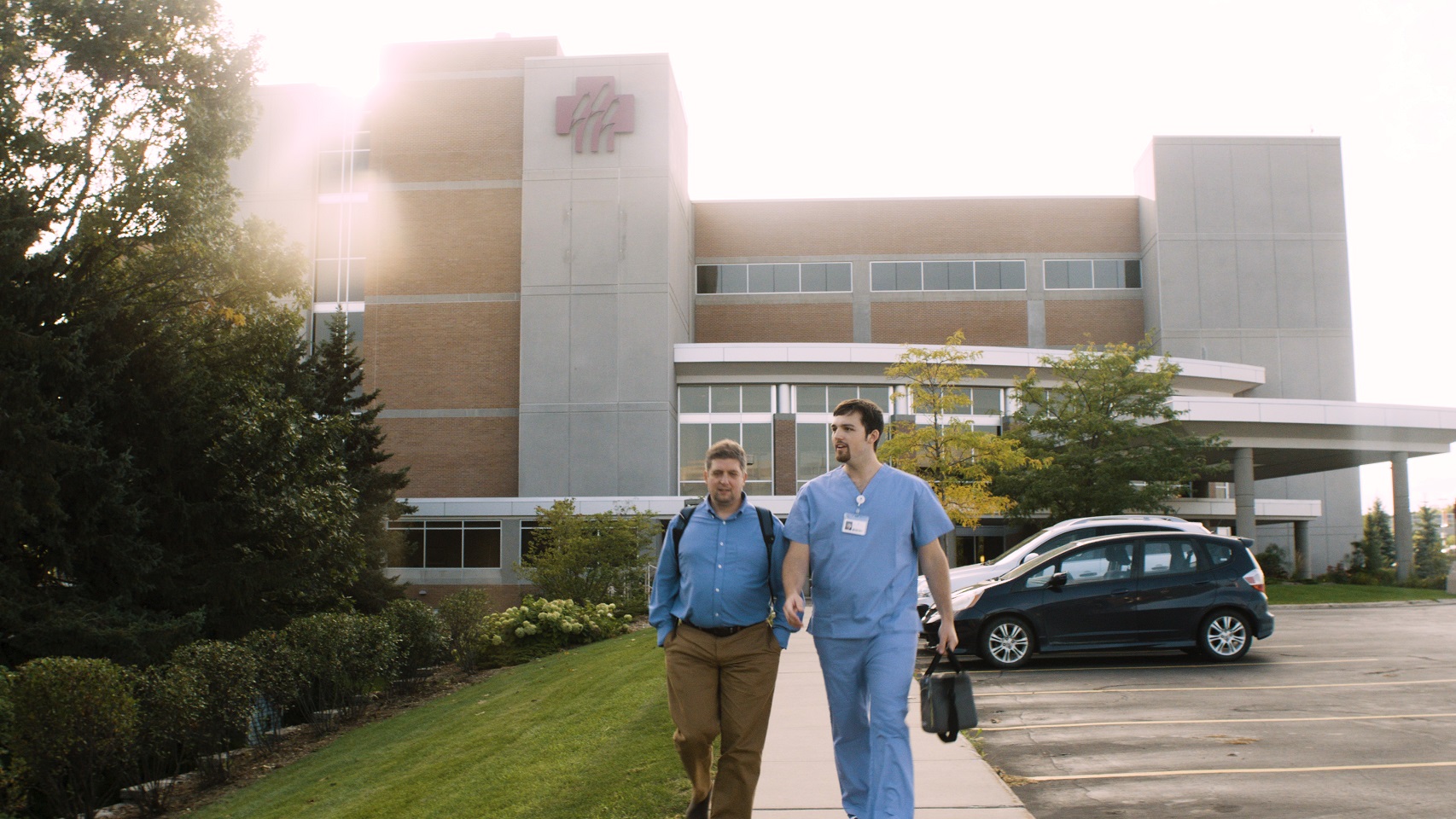 Image of employees walking out of entrance